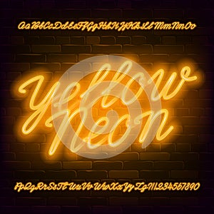 Yellow Neon script alphabet font. Neon color lowercase and uppercase bright letters and numbers. photo