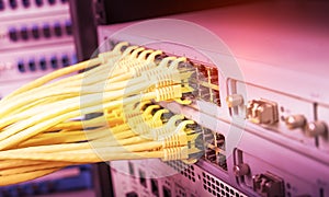 yellow network cable in switch and firewall in cloud computing data center