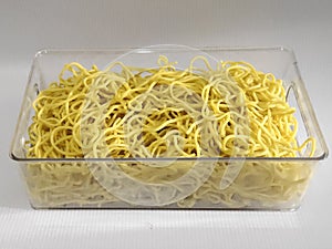 yellow noodle on the transparant plate