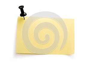 Yellow note with black pin
