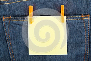 Yellow note on jeans