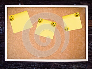 Yellow note pad on blank board