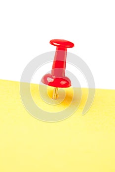 Yellow note paper with red pin