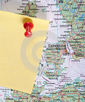 Yellow Note and red pin on map