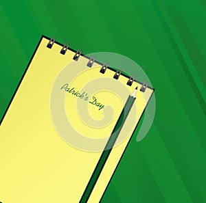 Yellow notebook with template hand-drawn Green festive bunting with clover and pencil. Irish holiday - Happy St. Patrick`s Day