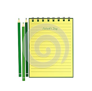 Yellow notebook with template hand-drawn Green festive bunting with clover and pencil. Irish holiday - Happy St. Patrick`s Day