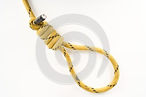 Yellow nylon cord tied as a hangman`s noose isolated on white