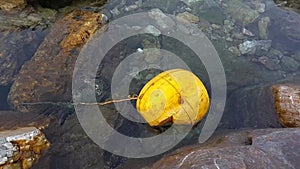 a yellow object being tied