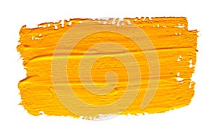 Yellow ochre strokes of the paint brush isolated photo