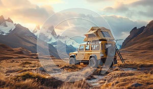 A yellow off-road vehicle with rooftop tent parked on cliff overlooking majestic mountain scenery at sunset. Adventure camping in