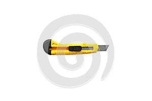 Yellow office knife isolated on white background