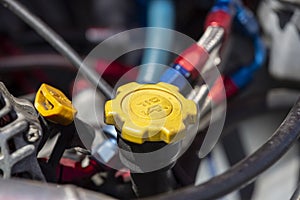 Yellow oil cap of a car