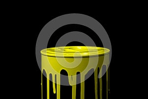 Yellow oil paint flowing down on wall of metal bucket. Isolated