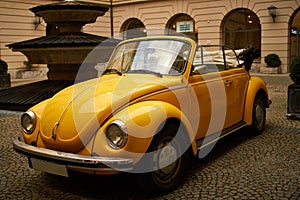 Yellow old Beatle VW in Munich