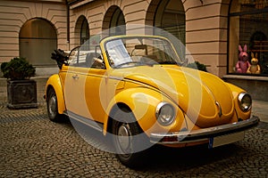 Yellow old Beatle VW in Munich