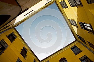 Yellow old building facade with blue sky