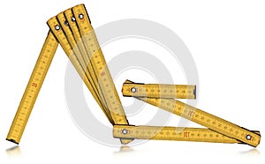 Yellow Old Wooden Folding Ruler Isolated on White Background