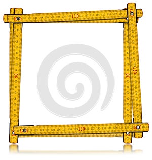 Yellow Old Wooden Folding Ruler Isolated on White Background