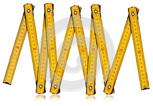 Yellow Old Wooden Folding Ruler Isolated on White Background