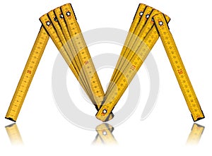 Yellow Old Wooden Folding Ruler in the shape of letter M - Meter