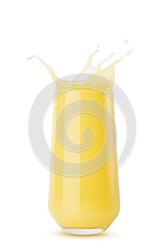 Yellow orange cool juice in glass juicy splashes and drops fly isolated on white background. Ripe summer fruit citrus drink with