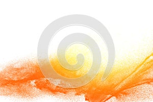 Yellow orange dust particles explosion on white background.