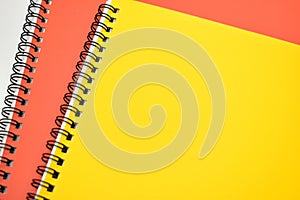 yellow and orange notebook on white background