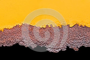 Yellow orange paint on an old metallic texture with a rusty pattern of corrode flakes