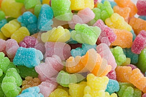 Many multicolored jelly gummy bears.