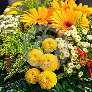 Yellow, orange, white flowering summer bouquet closeup photo