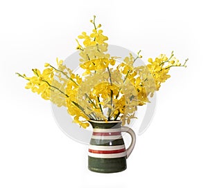 Yellow orchid flower arrangement on the vase isolated on white background for home decoration and summer design usage