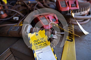 Yellow out of service tag attached on faulty damage  metal die grinder power tools