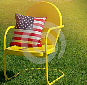 Yellow Outside Chair With Stars And Strips Pillow