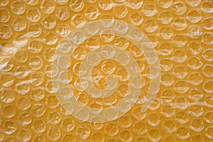 Yellow packaging with air bubbles background