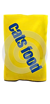 Yellow packaging of wet cat food with the words `cats food` on a white background.