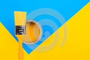 Yellow  Paint Can with Brush Top View On multicolor Background. - Image