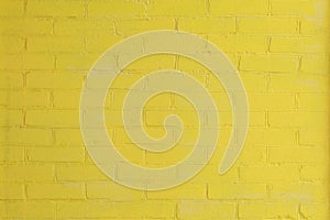 Yellow painted brick wall as a background or backdrop