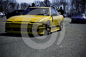 Yellow painted Car lowered and driving away