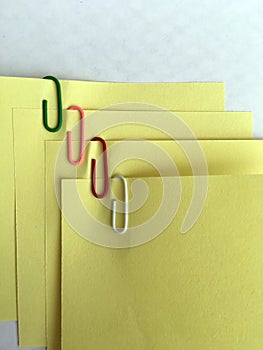 Yellow paper notes binden with staples. Notes and staples.