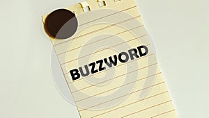 Yellow paper with text BUZZWORD on the white fridge