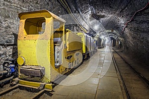 Yellow passenger underground train in a mine