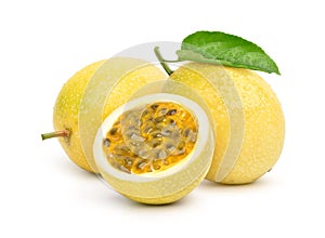 Yellow passion fruit with cut in half and green leaf