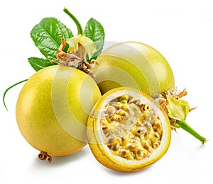 Yellow passion fruits and it\'s half with seedly interior on white background