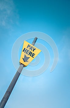 Yellow Pay Here Sign