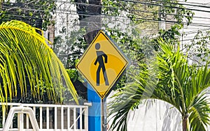 Yellow pedestrian sign street signin Playa del Carmen Mexico