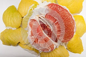 Yellow peeled pomelo cut in half. macro of insides