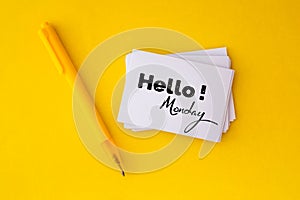 The yellow pen and stacking of white business card with Hello M