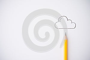 Yellow pencil and outline cloud on white paper background copy space. Creative idea, imagination and education concept.