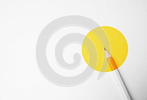 Yellow pencil on a white background, minimalism. Abstract art, imagination, education