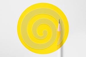 Yellow pencil with yellow circle